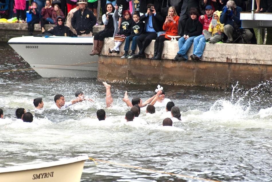 Peter Smith of Sarasota emerges from underwater, cross in hand, at this year’s Epiphany.