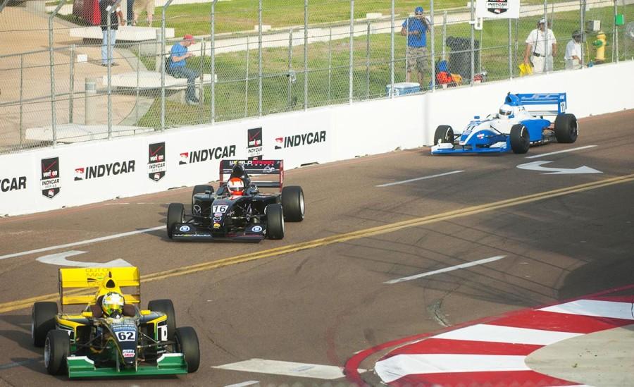 Indy cars race through the streets of St. Petersburg.