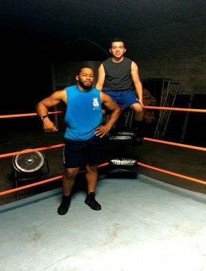 Alex Payne with coach Jay Lethal (left) in the ring.