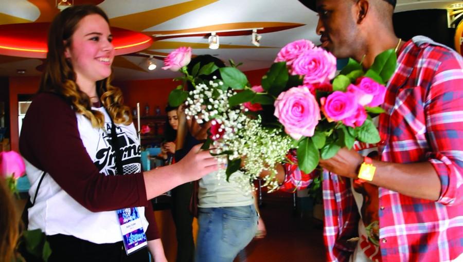 Swoozie hands out flowers to his fans.