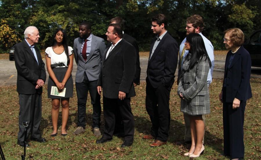 The Hawk Media Club interviews President Carter. The Carters pose for photos with all church attendees.