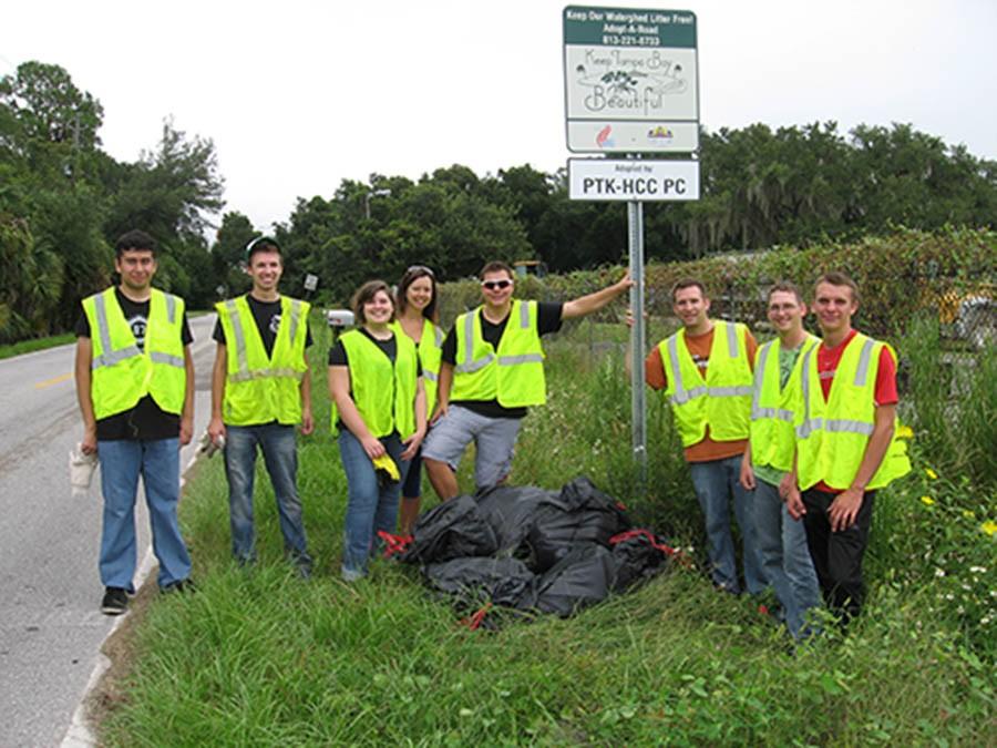 Members of the Phi Theta Kappa Plant City attend a roadside clean up.