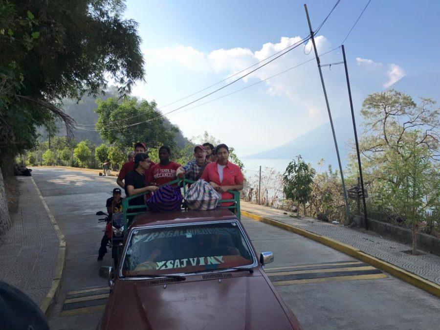 HCC students ride in the back of a pick up truck to get to and from work.