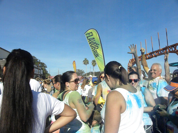 Runners get powdered at the finish line.