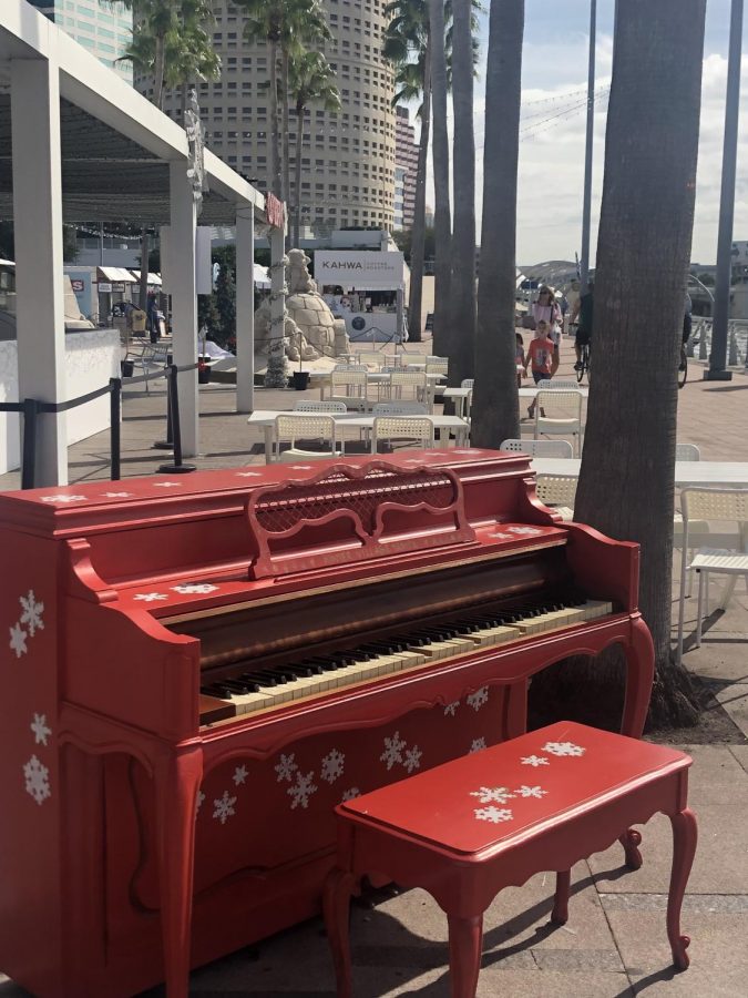A+festive+piano+at+the+foreground+of+the+Winter+Village+at+Curtis+Hixon+Park