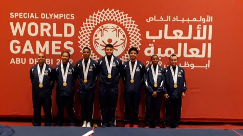 HCC student Albis Amayab (center) brought home the gold medal at the 2019 Special Olympics World Games. The team photo includes (left to rigth) Andrew Smiley, Trevor Powell, Phomar Williams, Albis Amaya, Jamel Winton, Jherran Whittaker and Shaun Ebanks.