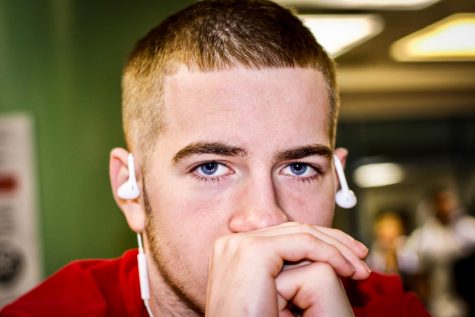 Lloyd Pidich Jr. casts a woeful stare as he waits for his next class to begin.