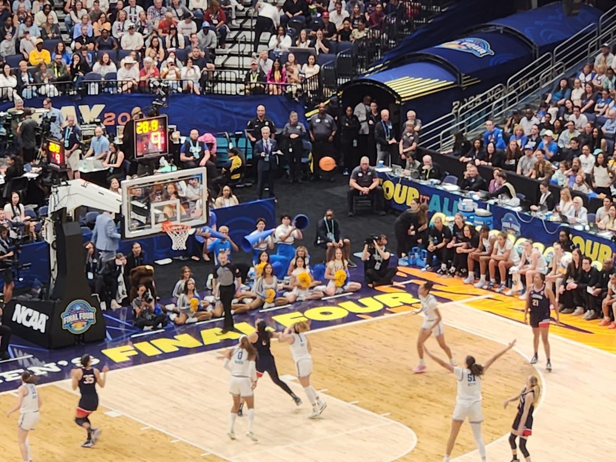 Paige Bueckers (No. 5) hits a 3-pointer for UConn.